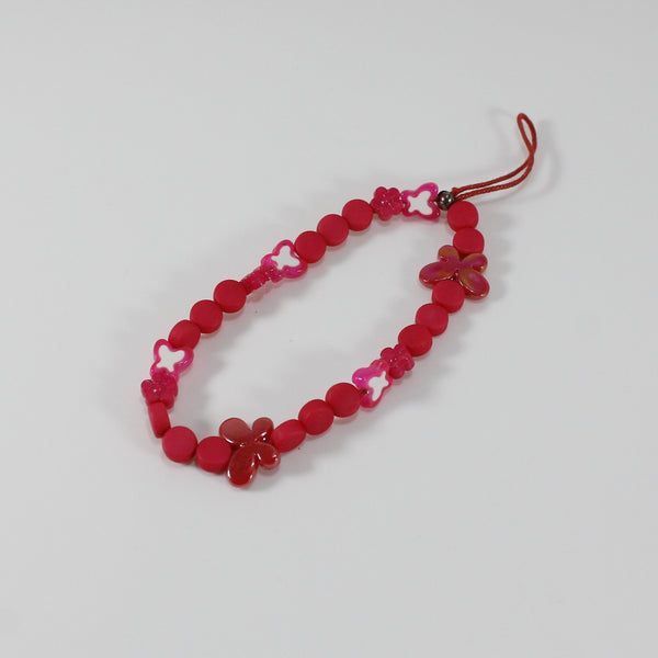 Bright pink adorned with butterflies phone wristlet for women