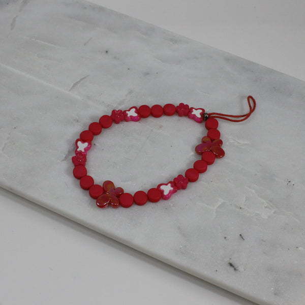 Bright pink adorned with butterflies phone wristlet for women