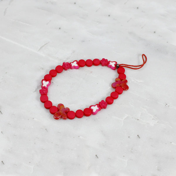 Bright pink adorned with butterflies phone wristlet for women