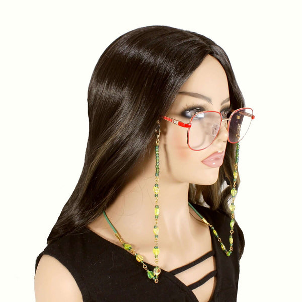 model wearing beaded eyeglasses holder with green and yellow beads