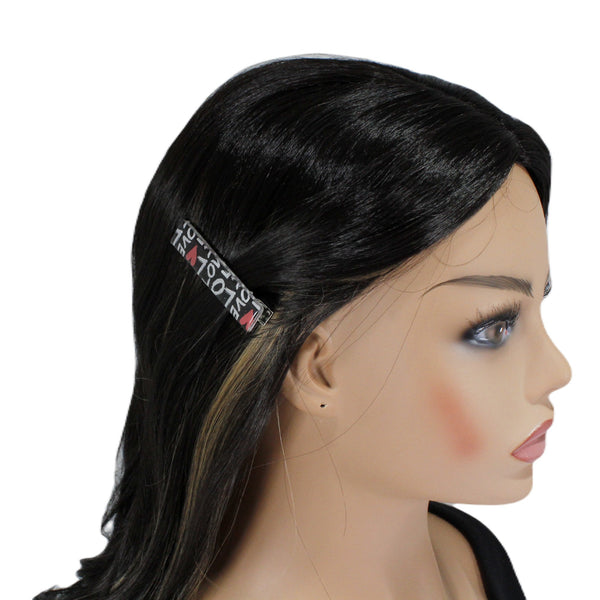 decorative alligator clip with words on it