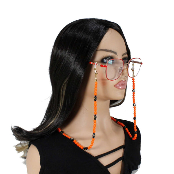 Handmade Halloween beaded eyeglass chain with orange and black beads, perfect for holding reading glasses or sunglasses.