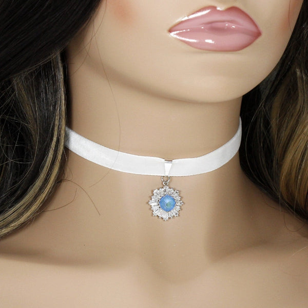 White velvet choker with blue cubic zirconia snowflake pendant