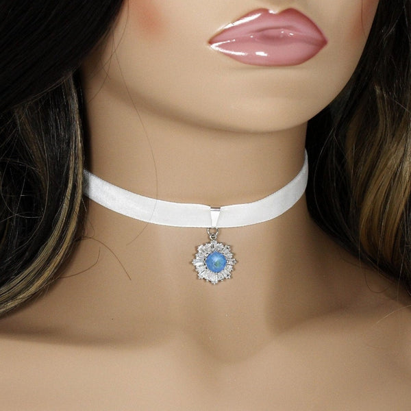 White velvet choker with blue cubic zirconia snowflake pendant