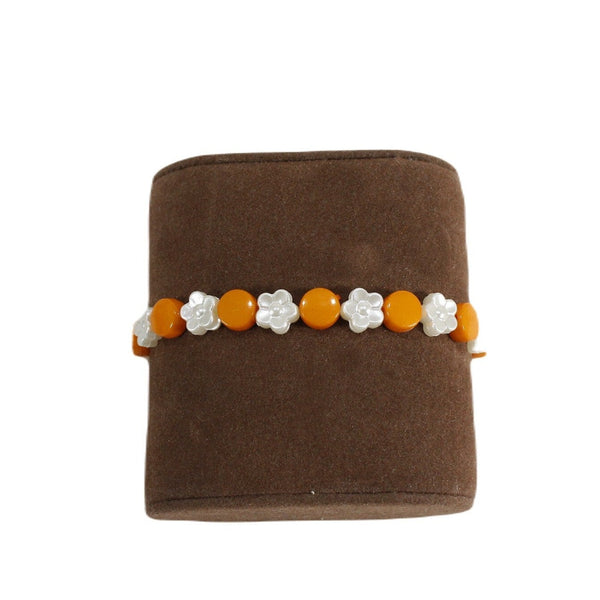 Orange with white flowers beaded stretch bracelet for women Media 2 of 3