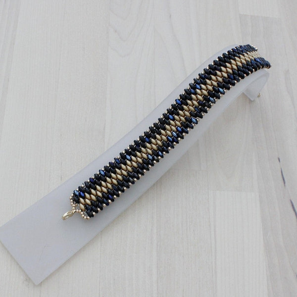 gold and black bracelet