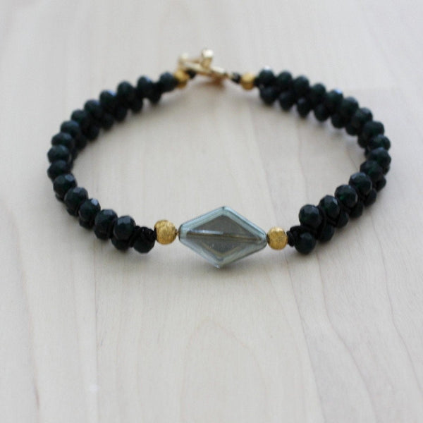 green bracelet with diamond shape centerpiece