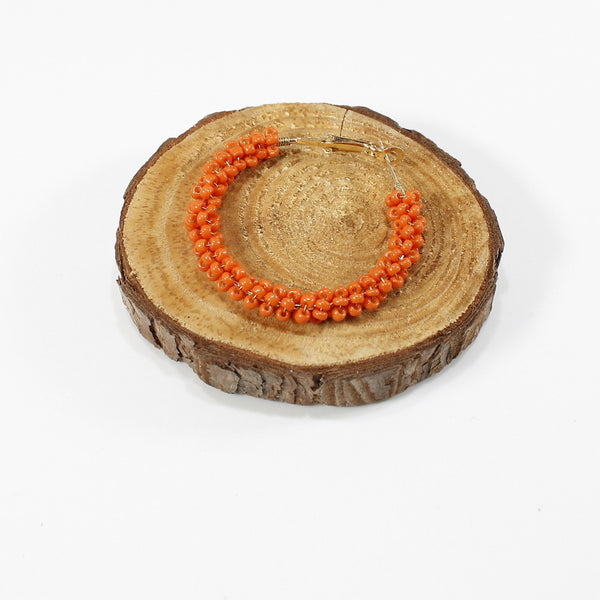 Cute and spooky Halloween inspired beaded hoops earrings with a spider charm