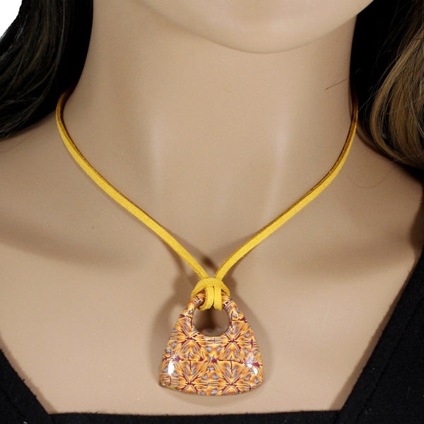 Handmade abstract pattern pendant with yellow faux suede cord and adjustable clasp