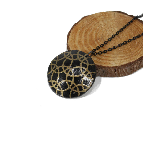 Black and gold pendant necklace