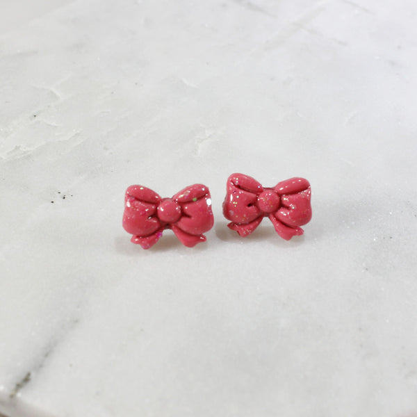 Charming pink bow stud earrings