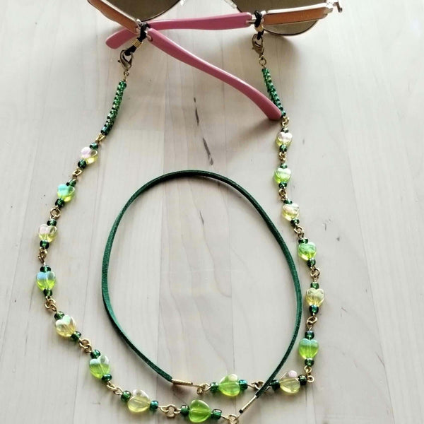 beaded eyeglasses holder with green and yellow beads attached to sunglasses. The middle part made from soft faux suede for comfort of your neck
