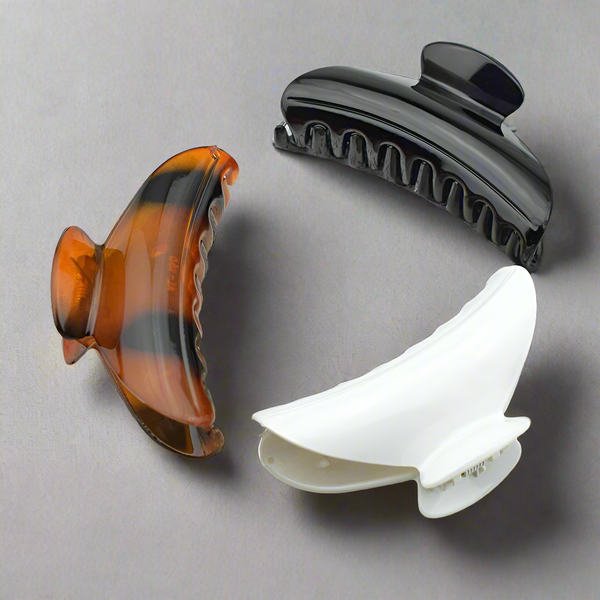 large hair claw clips in black, white and tortoise