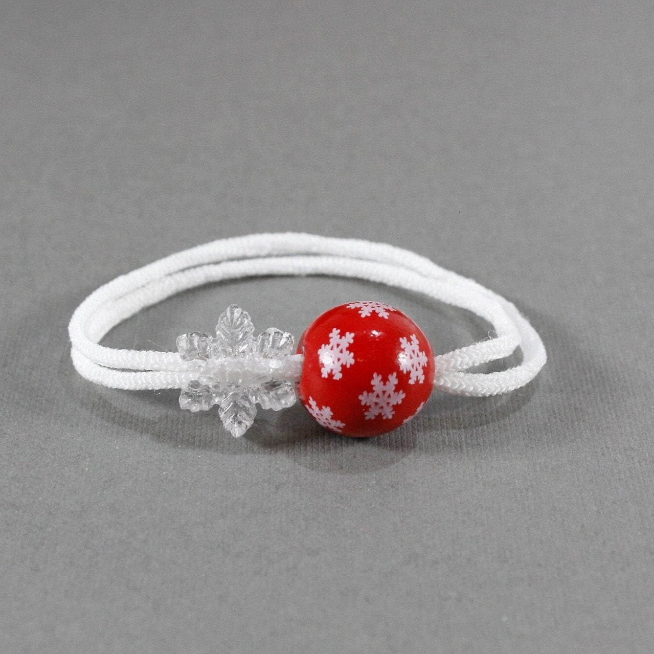 Set of two red with crystal-clear snowflakes embellishments hair ties